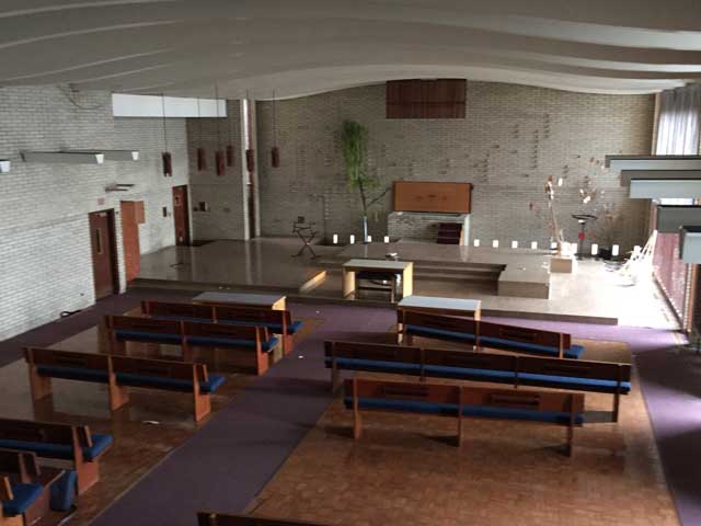 view from the choir loft overlooking the stage of the chapel.