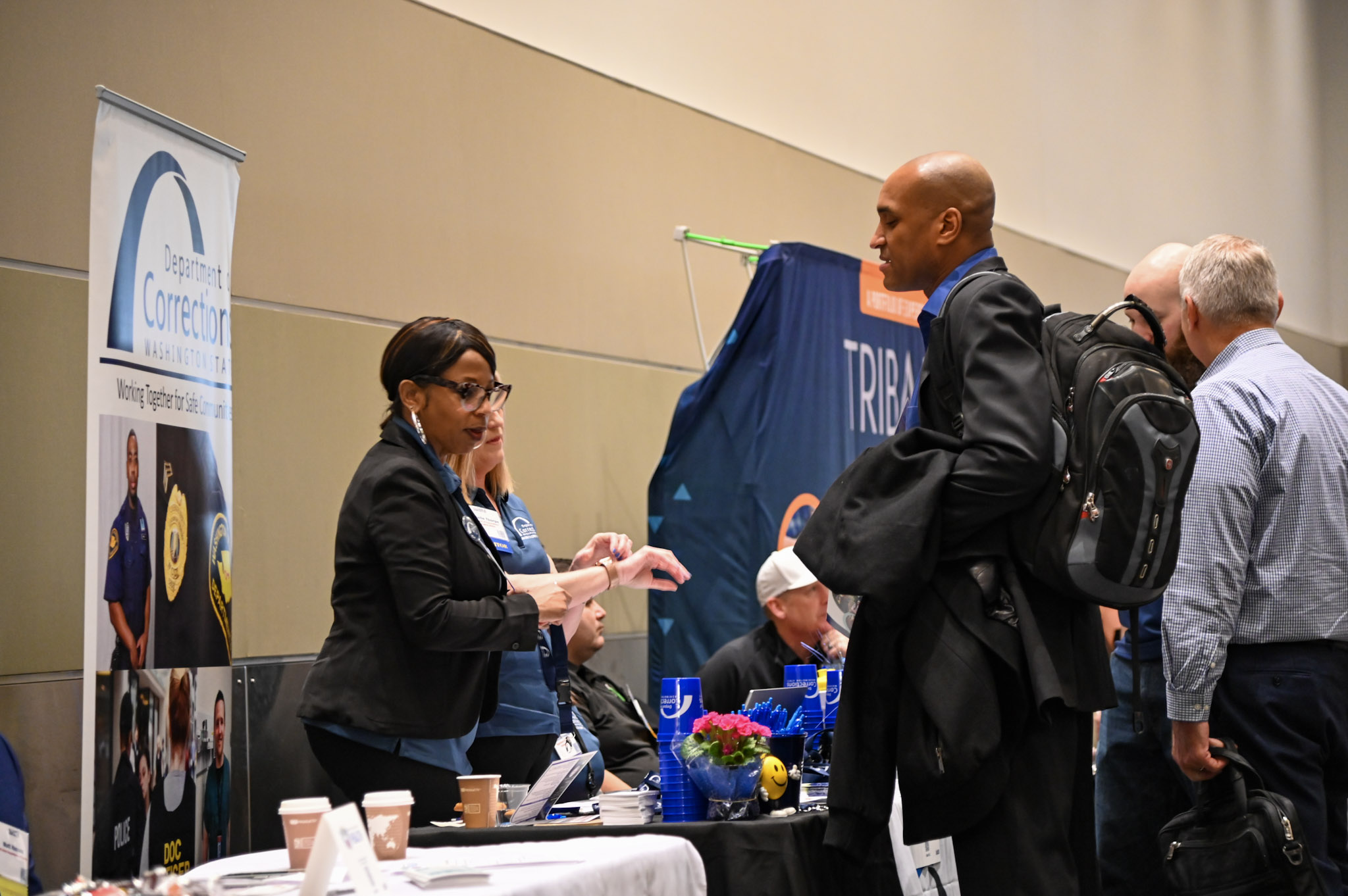 two people talking at vendor event