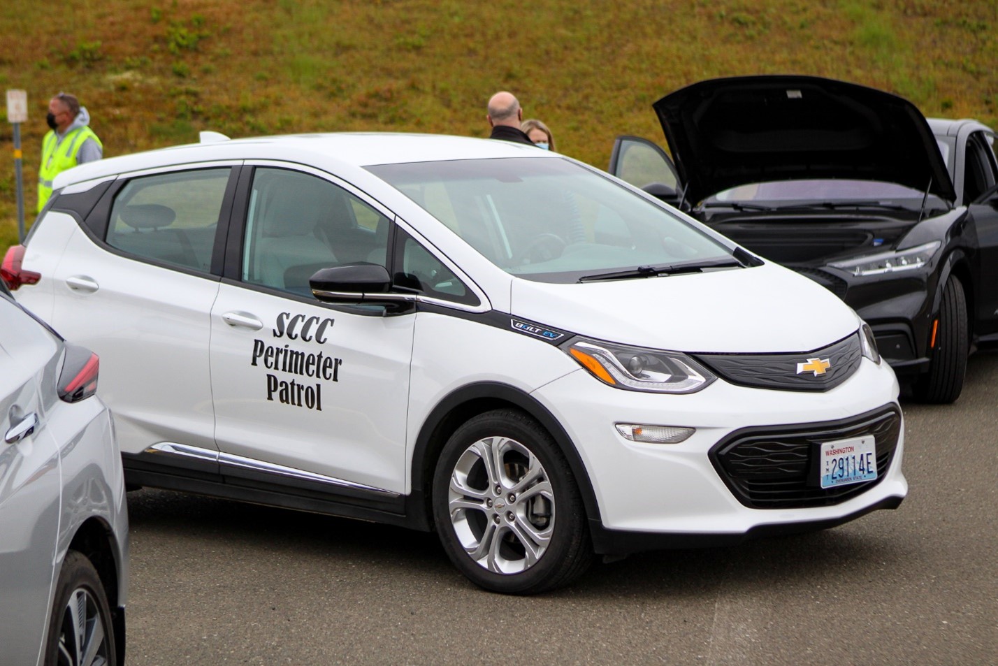 a chevyrolet bolt electric vehicle driving in a parking lot