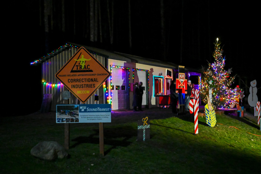 A storage shed decorated with Christmas decorations.