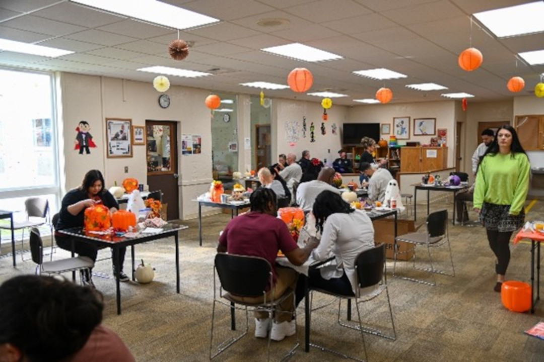 Group of people crafting in a large room