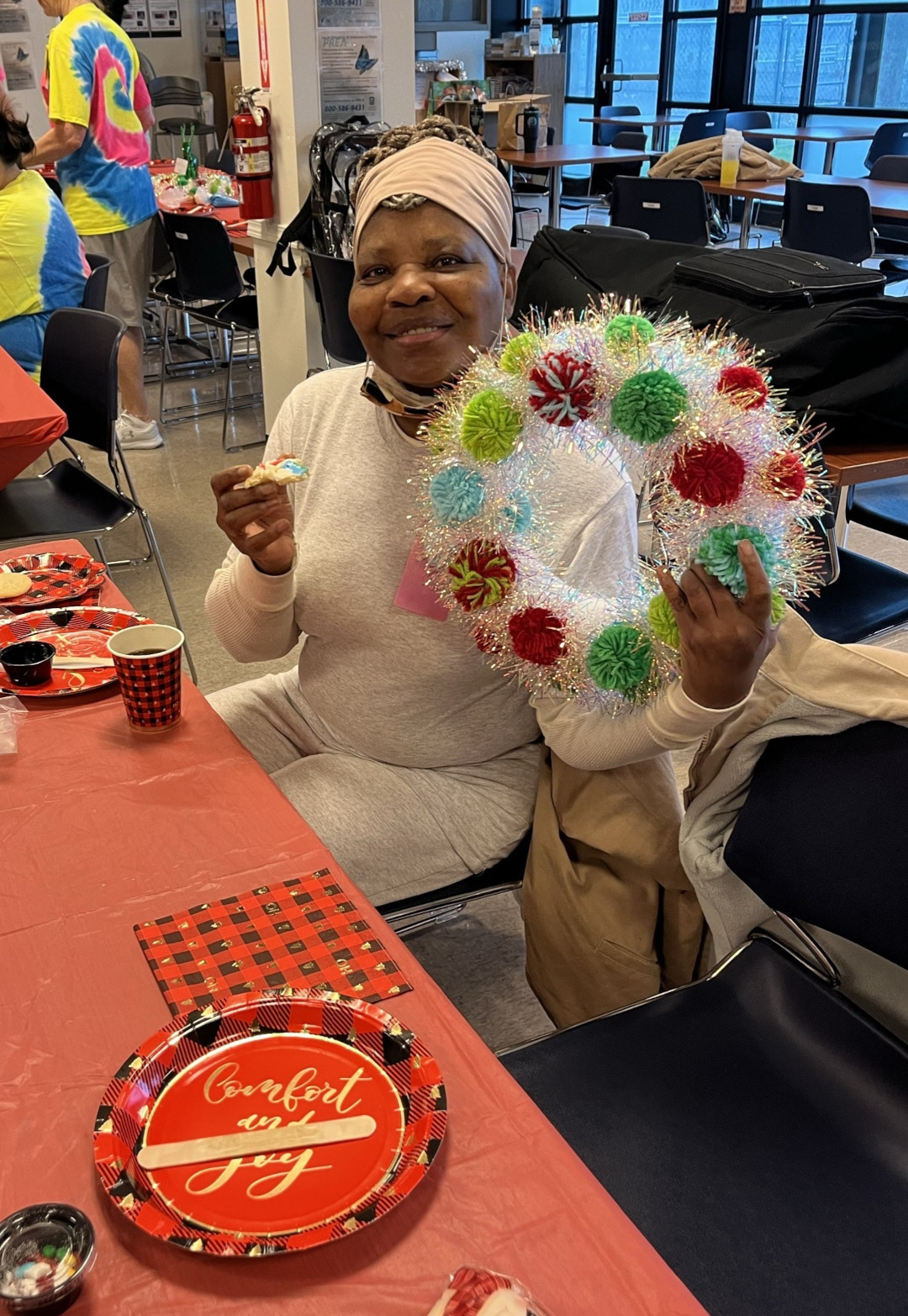 Woman sitting holding decorations