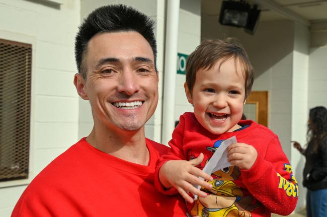Father and son smiling