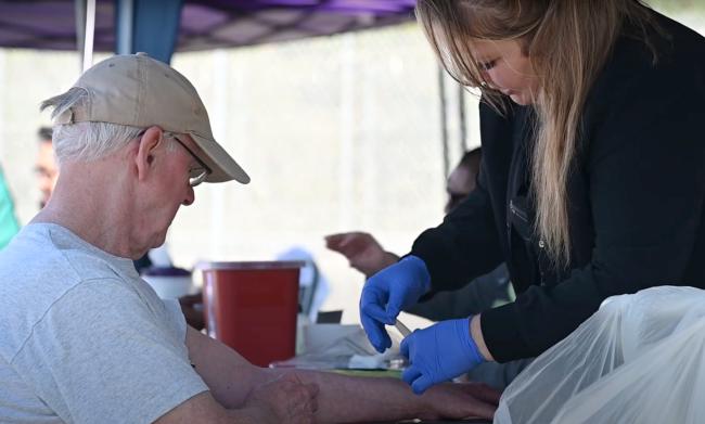 Nurse performing wellness exam