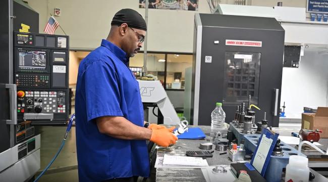 A CNC Machinist, builds aerospace parts at DEMGY Pacific.