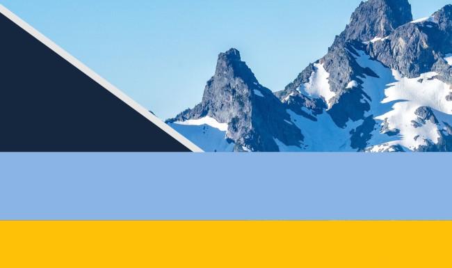 Geometric shape with mountains in the background.